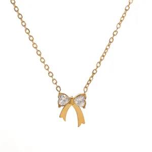 Elegant gold necklace featuring a sparkling rhinestone bow pendant with heart stones