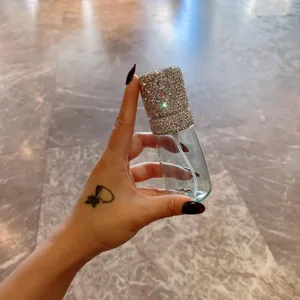 Luxury rhinestone encrusted refillable spray bottle for fine mist skincare toner