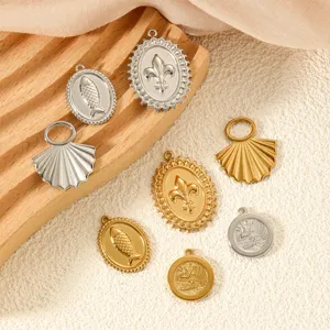 Close-up of assorted stainless steel DIY jewelry pendants in gold and silver finishes