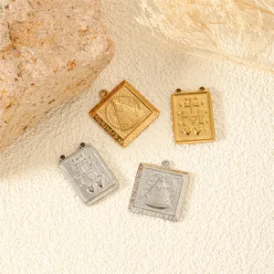 Detailed close-up of religious stainless steel pendants with gold and silver finishes