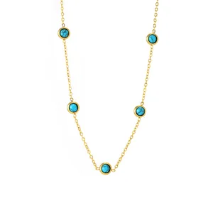 Detailed view of gold-plated stainless steel bracelet with five round turquoise stations