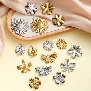 Detailed macro view of assorted stainless steel flower and butterfly charms for jewelry