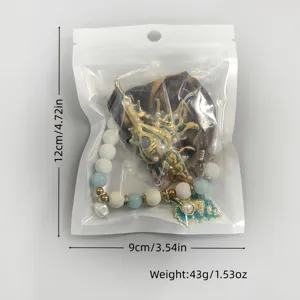 Specific size and weight details of the luminous sea shell necklace in clear packaging.