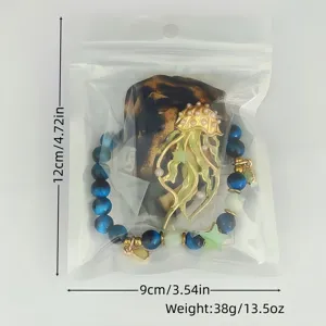 Detail showing luminous jellyfish necklace with leopard ribbon in 12x9cm packaging bag