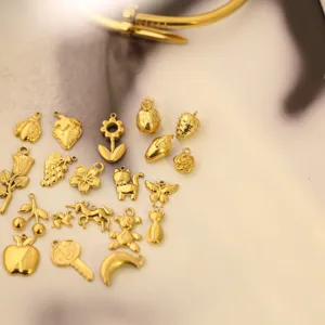 Collection of golden stainless steel DIY charms in various cute and floral shapes