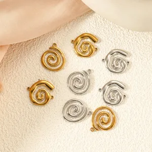 Detail view of gold and silver spiral stainless steel charms for DIY jewelry making