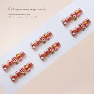 Close-up of dopamine handmade press-on nails with 3D bear and heart designs