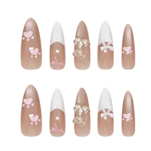 Handmade pink cat-eye press-on nails with cute 3D bear and bow charms for women