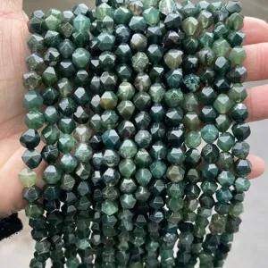 Detailed macro view of faceted natural green moss agate beads for DIY jewelry making