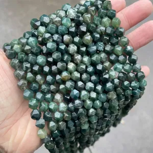 Close-up of faceted natural water moss green agate rhombus beads for jewelry DIY