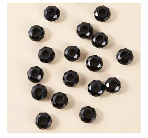 Detail view of 14mm faceted black crystal beads with large holes for DIY jewelry.