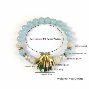 Annotated detail of beach style luminous shell necklace with dimensions and materials