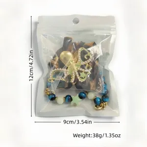 Detail view of glow-in-the-dark octopus necklace with size and weight info