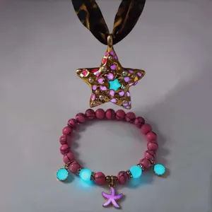 Luminous star necklace and starfish bracelet set with glowing details and leopard ribbon.