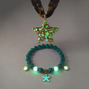 Detail of luminous star pendant necklace and starfish bracelet with turquoise beads