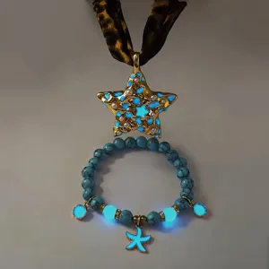 Detailed view of a glowing star necklace and starfish bracelet with luminous beads.