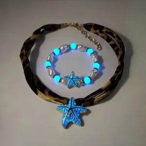 Lichtgevende blauwe zeester sieradenset met luipaardprint choker en parelarmband