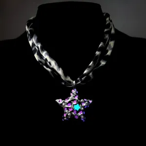 Macro view showing the glowing star pendant on a retro leopard print fabric necklace.
