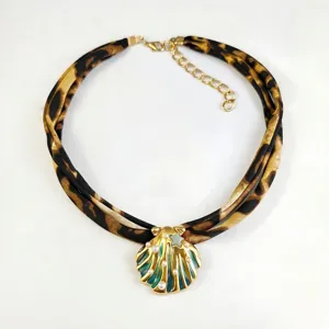Luminous gold shell pendant necklace with leopard print fabric strap and pearls