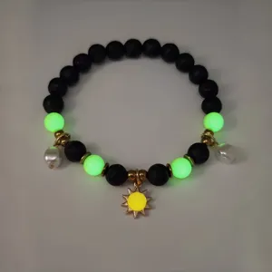 Glow-in-the-dark beaded bracelet with golden sun pendant for beach vacation