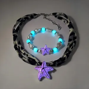 Lichtgevende zeester ketting en armband sieradenset met in het donker gloeiende kralen