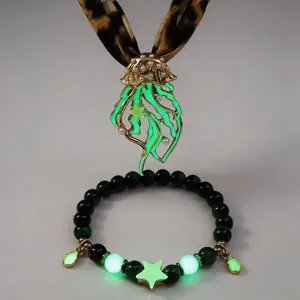Detailed shot of luminous jellyfish pendant and glowing star beaded bracelet set