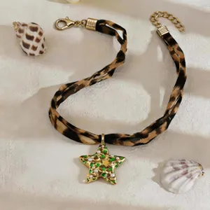 Vintage leopard print choker with green star pendant for seaside vacations
