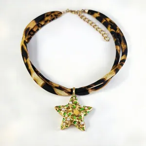Leopard print fabric necklace with luminous gold star pendant and pearl accents for women