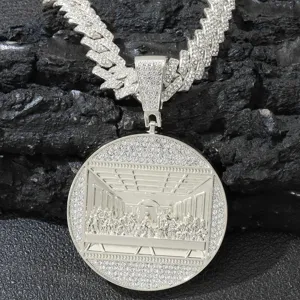 Detail view of The Last Supper round pendant with iced out Cuban link chain necklace.