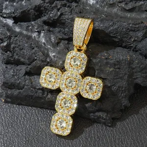 Close-up of a gold-plated iced out cross pendant featuring brilliant rhinestones.