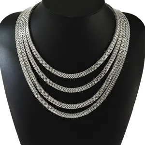 Detailed close-up showing texture of layered silver stainless steel double Franco chain necklaces