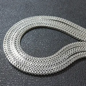 Close-up of a high-polish stainless steel double-row Franco chain necklace