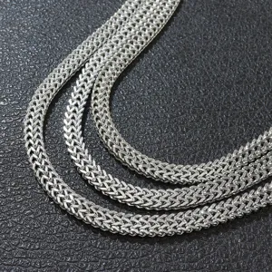 Detailed close-up showing the intricate weave of the silver double Franco chain necklace