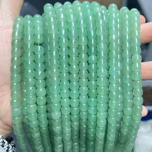 Macro detail of natural green aventurine old-shape beads with translucent texture