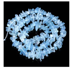 Detail of natural aquamarine chip beads for DIY jewelry making with icy blue texture