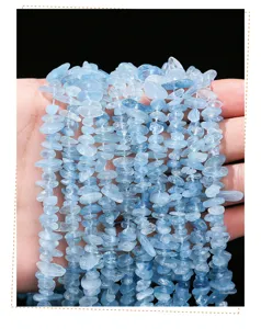 Macro view of translucent light blue natural aquamarine stone chips for DIY jewelry making