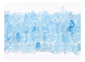 Macro detail view of natural translucent light blue aquamarine crushed stone beads for DIY