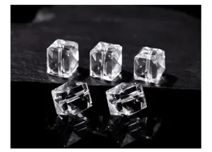 Close-up of faceted natural white crystal cube beads showing transparent texture