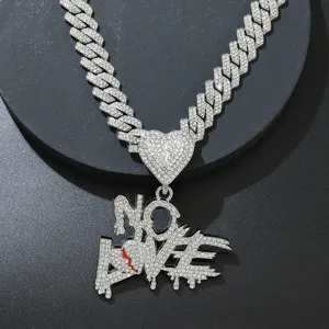 Detailed view of rhinestone encrusted NO LOVE letter pendant Cuban link chain