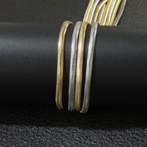 Detailed close-up of 3mm wide stainless steel flat snake chain necklaces gold and silver