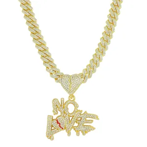 Close-up of iced-out NO LOVE pendant necklace featuring broken heart and Cuban chain