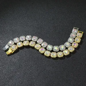 Macro detail of gold and silver hip-hop bracelets featuring iridescent heart crystals.