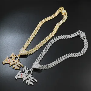 Detailed macro shot of iced out NO LOVE pendant with broken heart on a thick Cuban chain