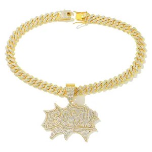 Macro view of gold-tone Cuban link necklace with a diamond-encrusted BOM pendant