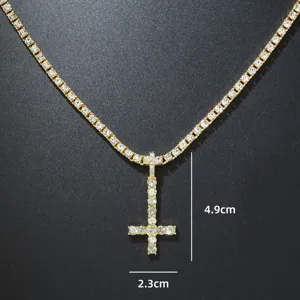 Detailed view of iced out inverted cross pendant with 4.9x2.3cm dimensions
