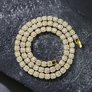 Close-up of a 6mm gold iced-out square chain necklace with sparkling clear rhinestones