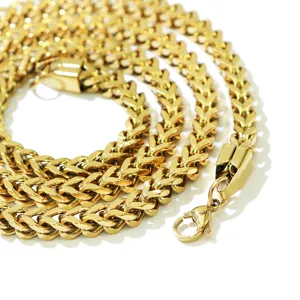 Close-up detail of a gold-plated stainless steel Franco chain with a lobster clasp