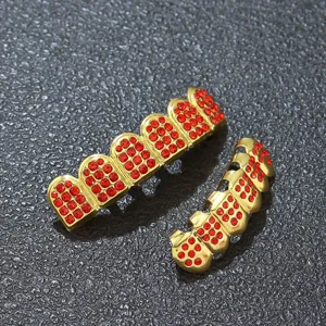 Detailed view of hip hop gold teeth grills with vibrant red rhinestone pave setting