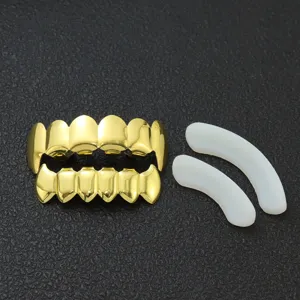 Set completo di grillz hip-hop dorati lucidi con zanne di vampiro e barre kit