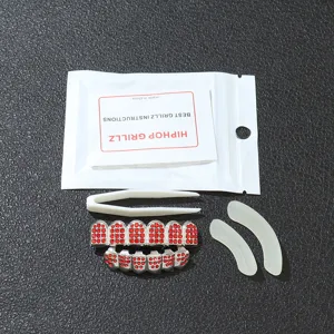 Silver hip-hop teeth grill set with red rhinestones including tweezers and molding bars